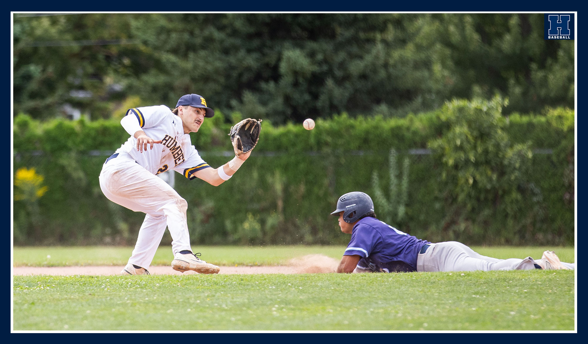 Bruin player sliding into second trying to avoid the tag