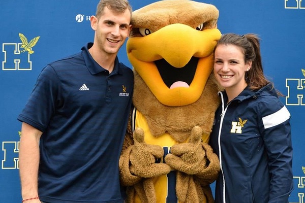 Julia posing for a photo with the Humber mascot