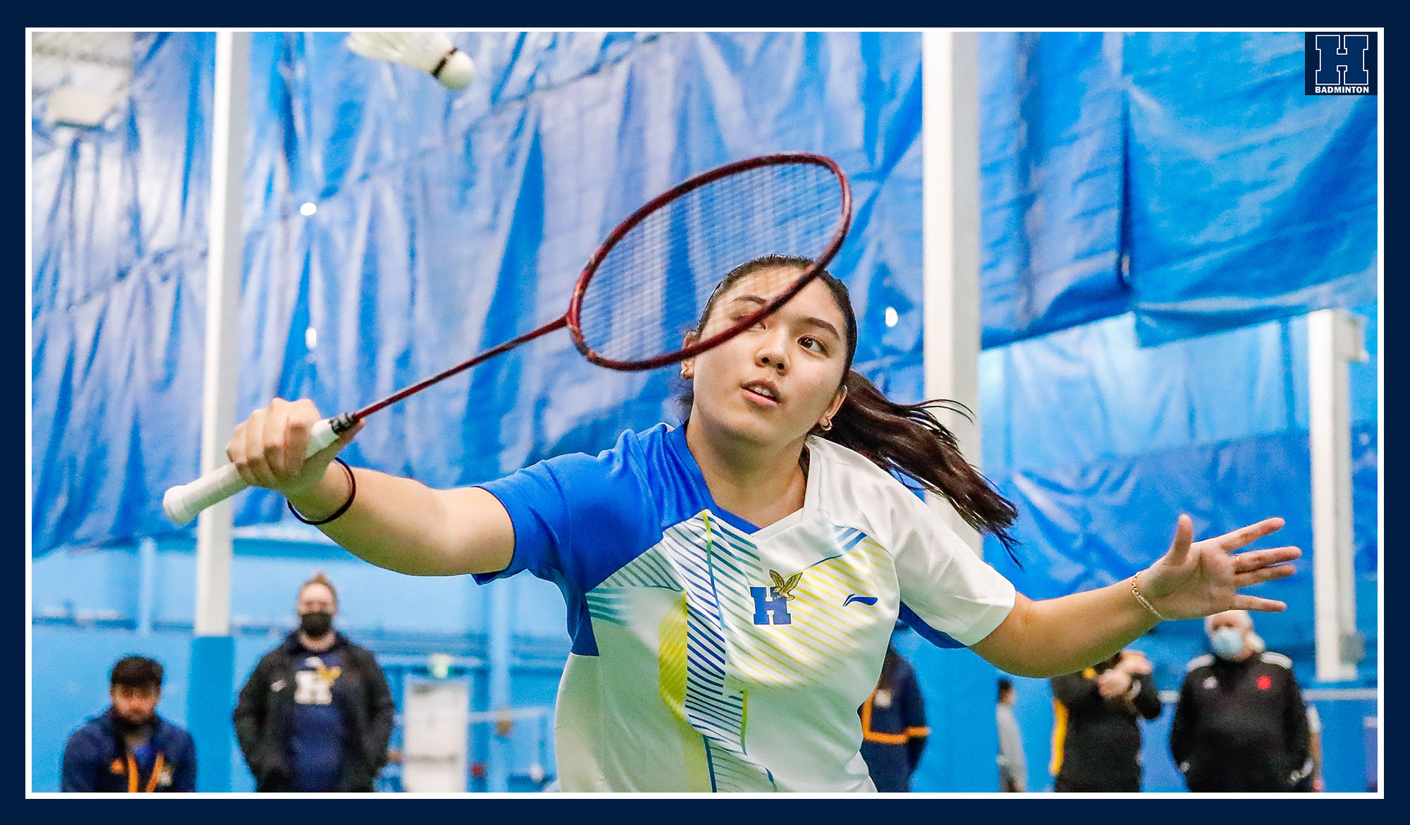 Airi returning a serve in badminton