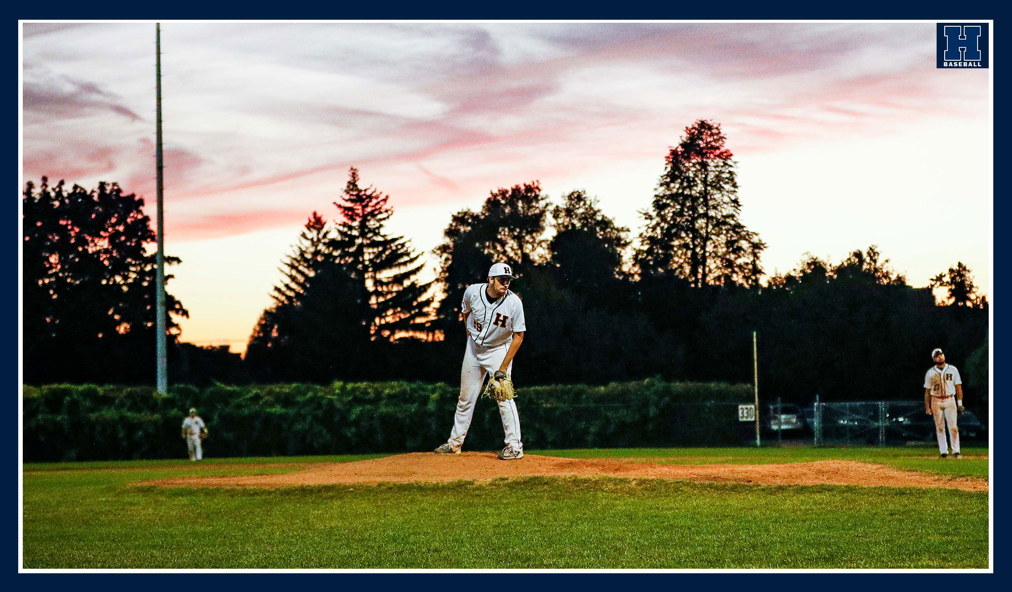 Humber baseball pitching with a nice skyline