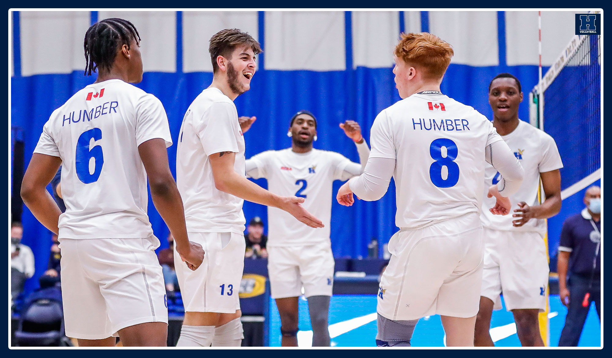 Men's volleyball celebrating a point.