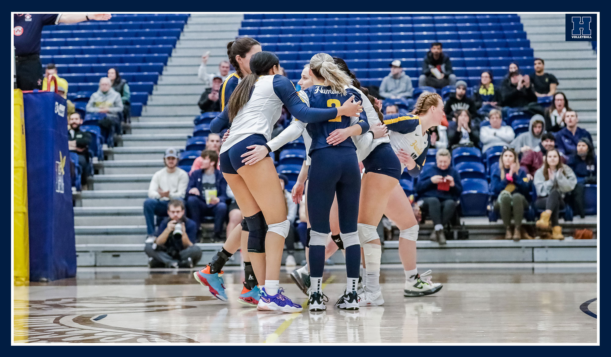 Women's volleyball celebrating a point against St. Clair
